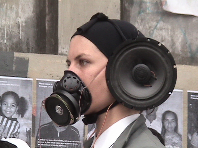 Veridiana Zurita with Pharmakon performance group in front of the squatted building at Prestes Maia Avenue, in São Paulo (2004). It was one of several attempts to bring attention to the condition of 468 families being evicted due to a process of gentrification conducted in the city centre.